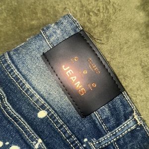 Brand new blue Jean with designs on it. No tags but, it has never been used